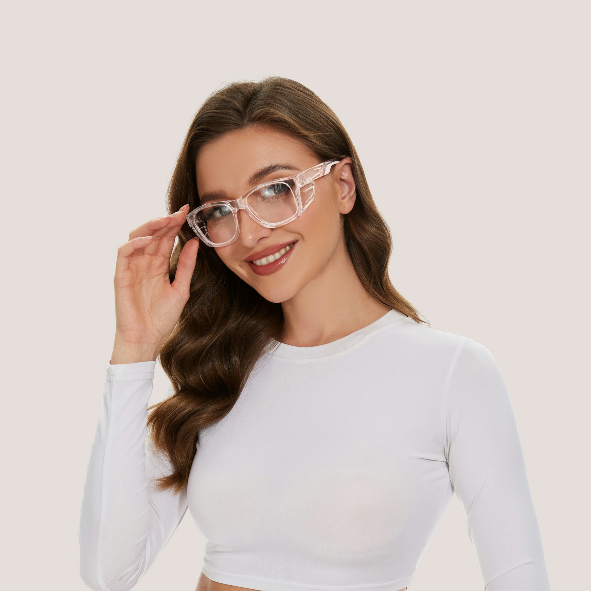 a woman wearing a white crop top and clear glasses
